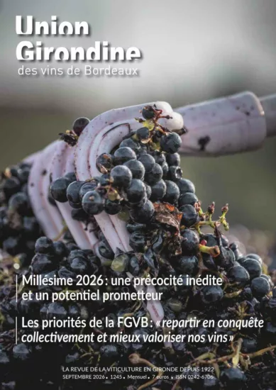 couverture du magazine de l'union girondine des vins de bordeaux réprésentant une grille dans des baies de raisins rouges pendant les vendanges